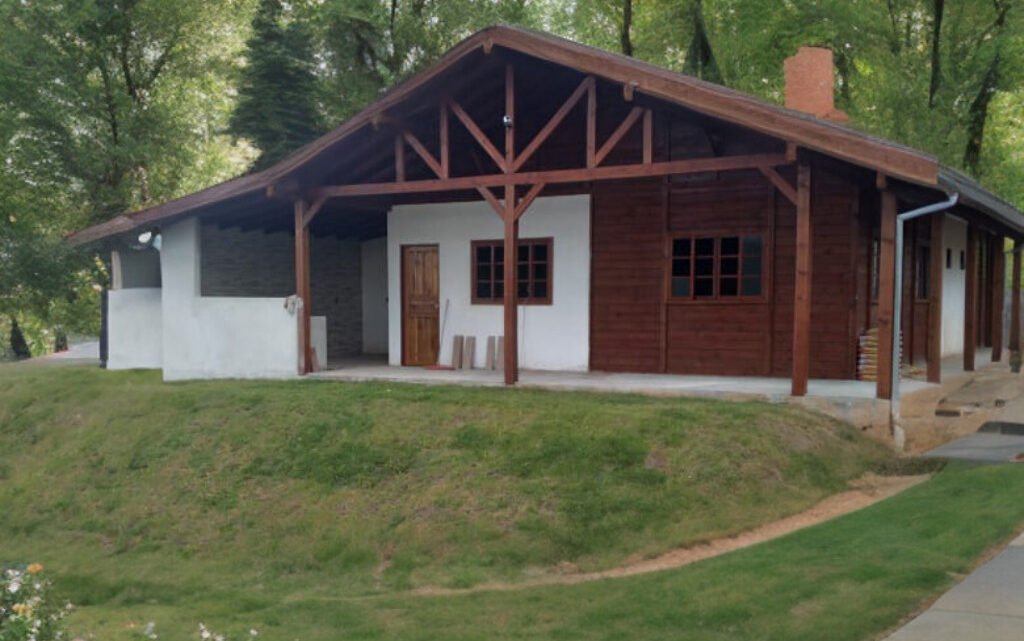 A casa de madeira, o refúgio encantador que acalma a alma.